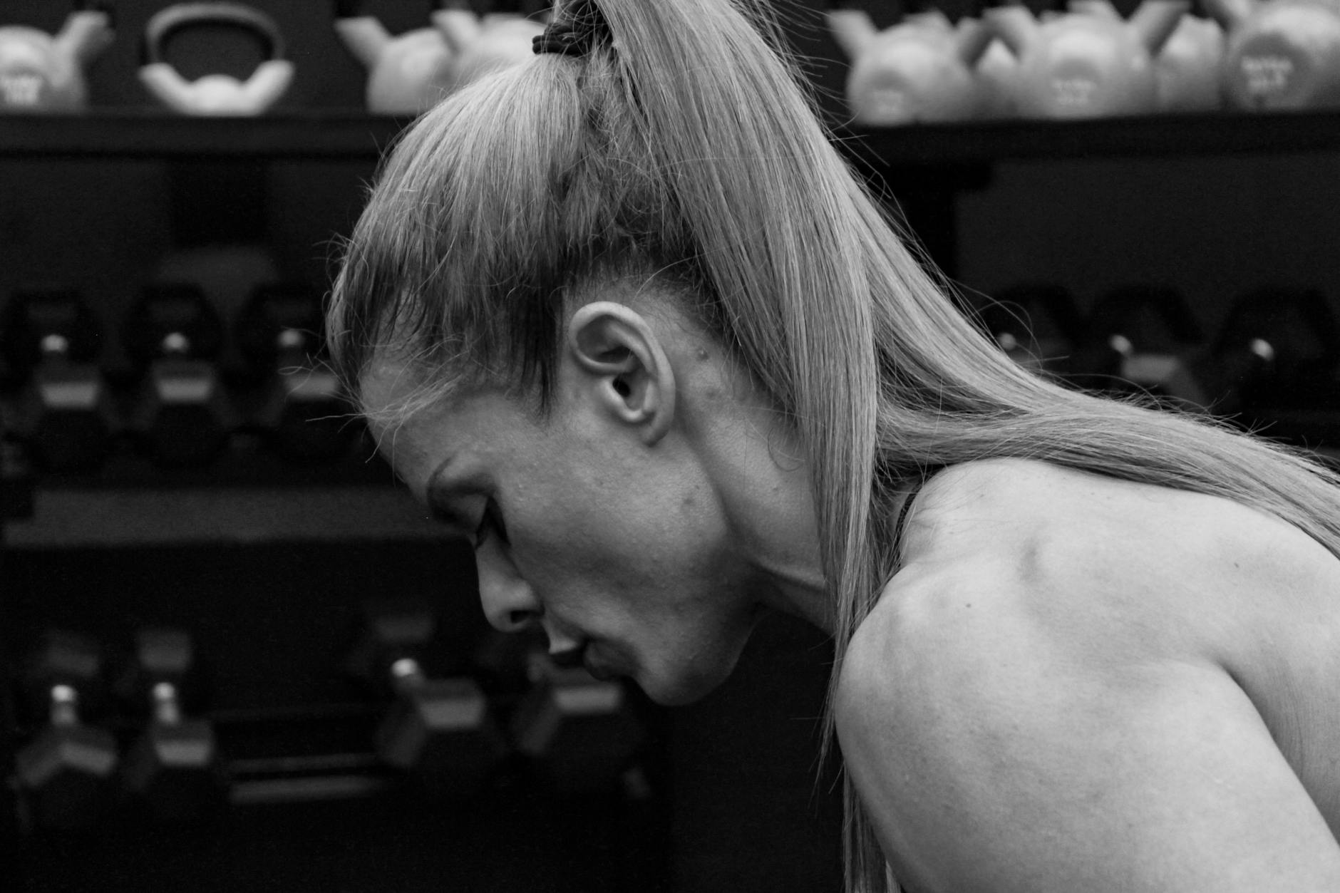 black and white photo of a woman with ponytail